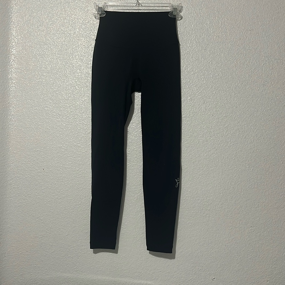 Basic black leggings. Brand unknown, simple, never worn, in excellent condition.